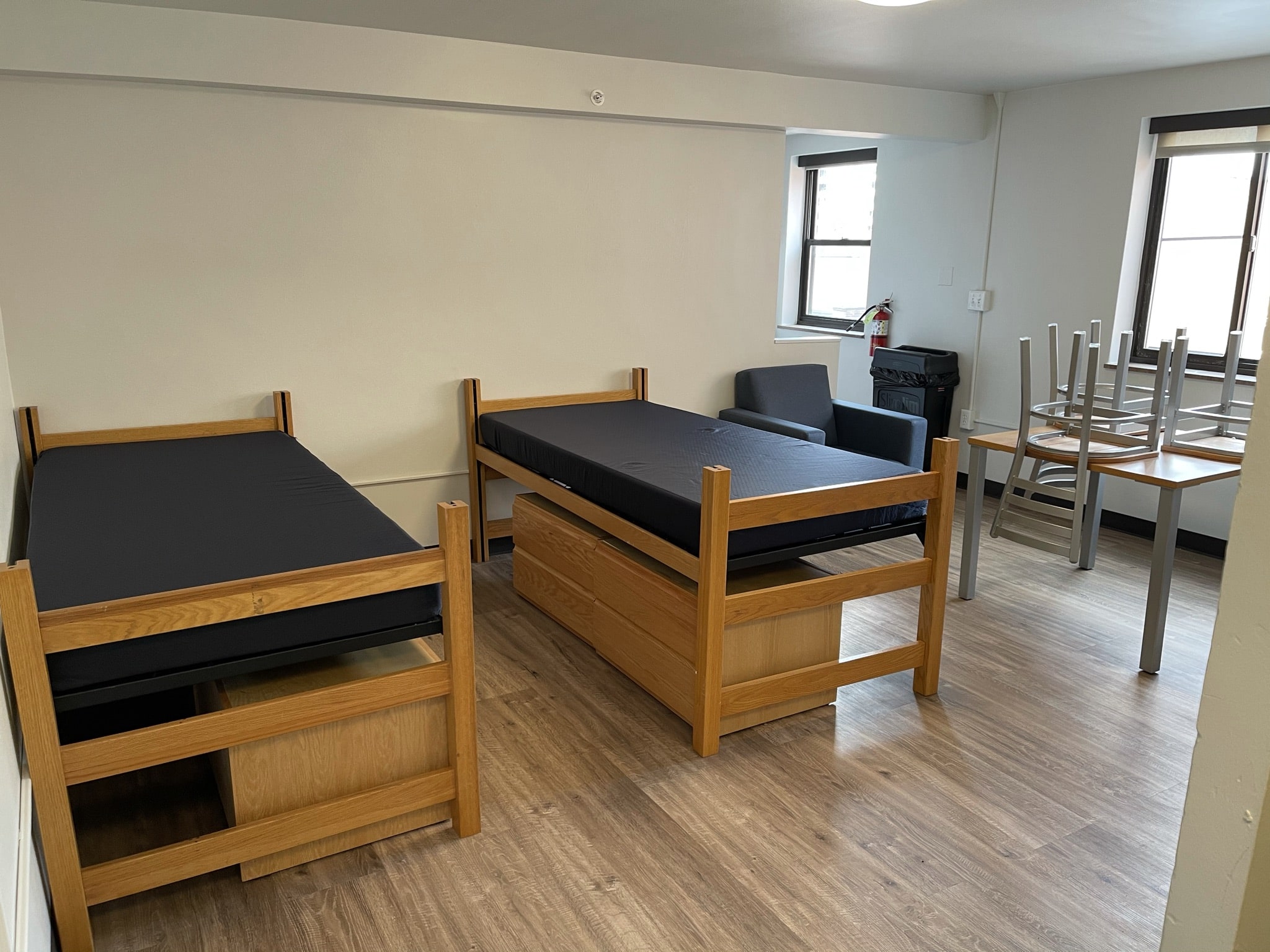 Fifth Neville Studio Apartment Main Room - bed with storage underneath, another bed with storage, table and chairs