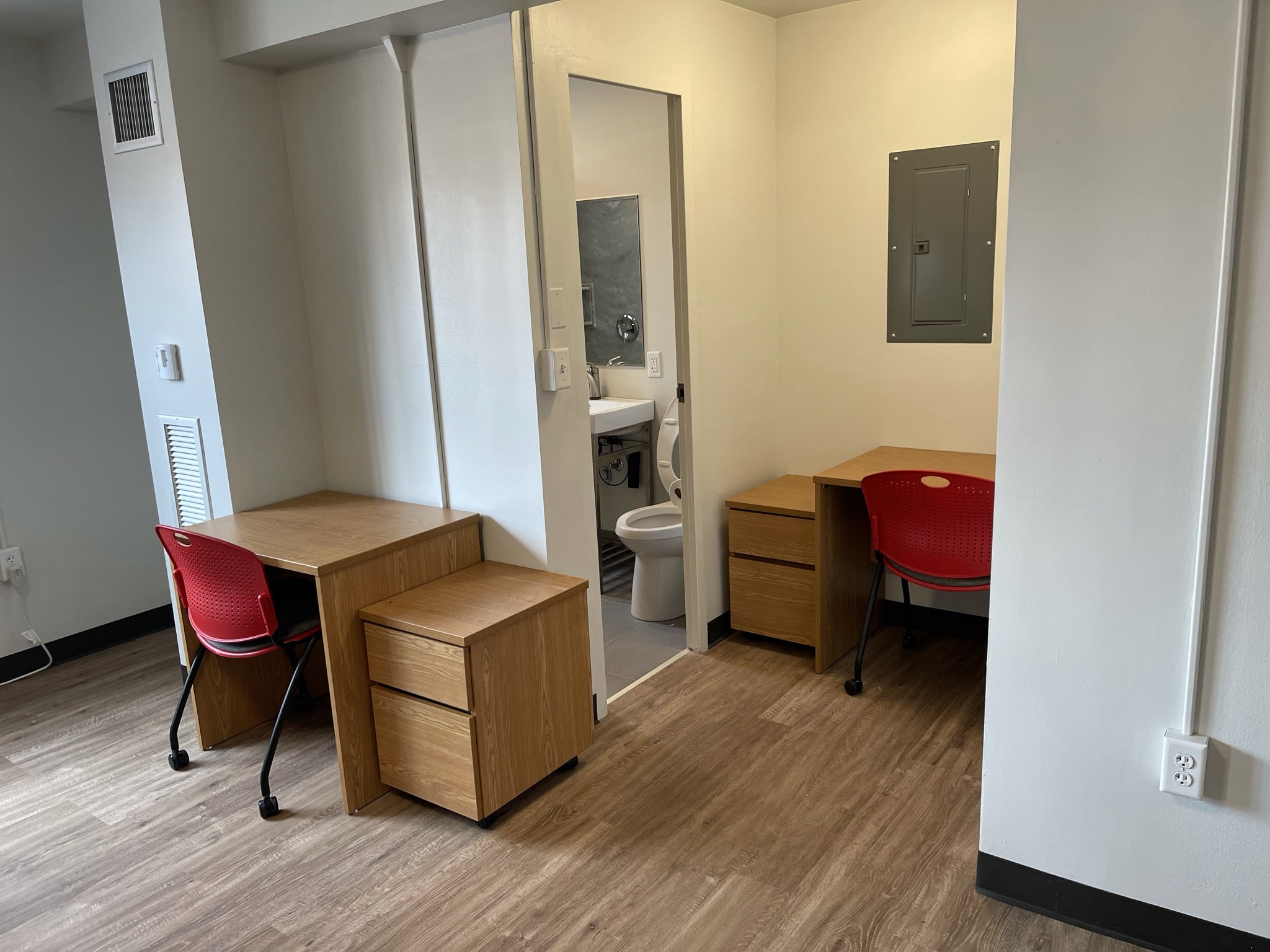 Fifth Neville Studio Apartment Main Room (another view) - desk, chair with chair, side table, another desk with chair and side table