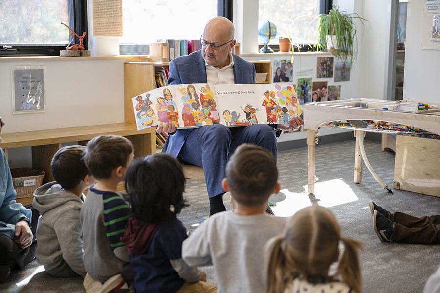 President Jahanian reading to children in preschool classroom