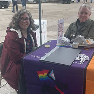 LGBTQIA+ leads at a table at Carnival