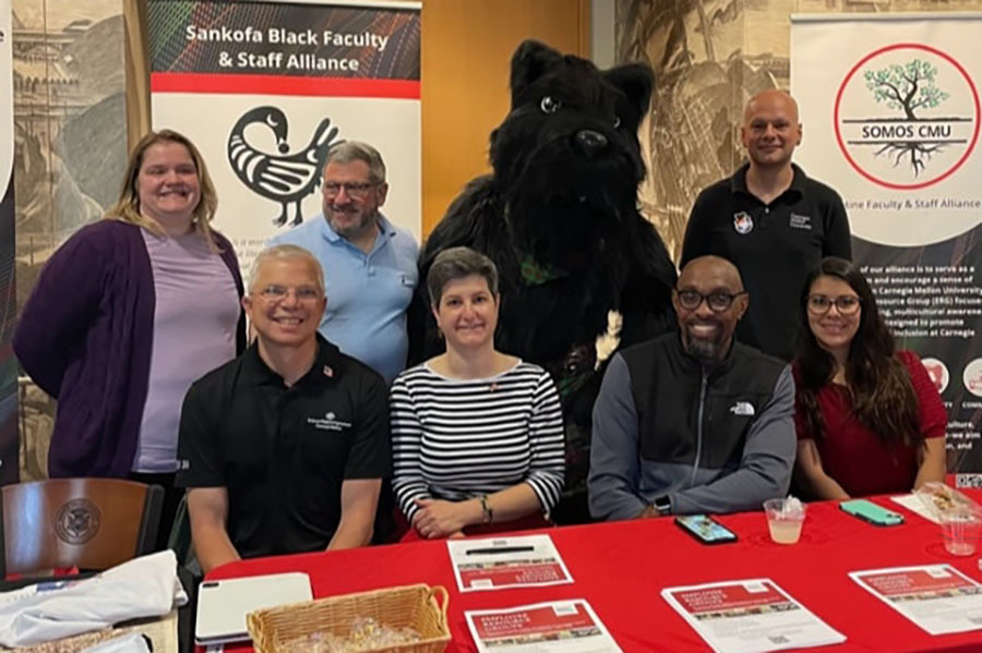 ERG co-leads and representatives posing with Scotty Dog mascot during CMU Community Picnic