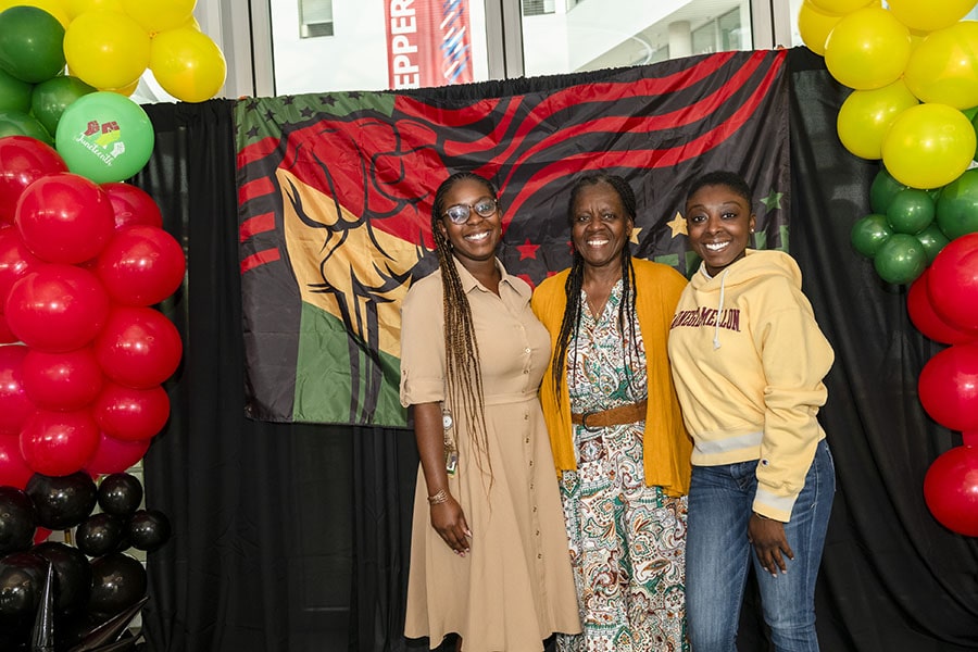 Attendees pose for a photo during the Juneteenth reception