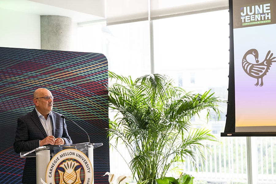 President Jahanian speaks at a podium during the Juneteenth reception