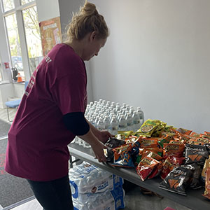 Employee resource group member serving food during Special Olympics event