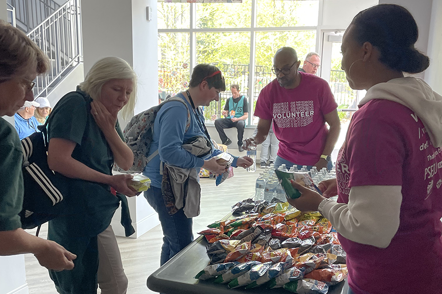 ERG co-leads serving food at Special Olympics event