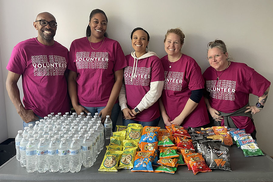 ERG co-leads serving food at Special Olympics event