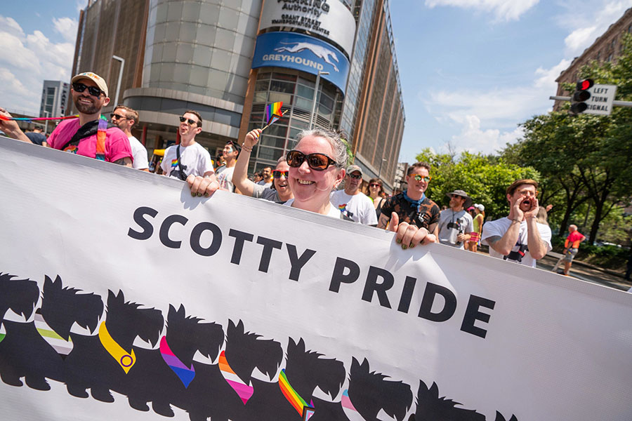 CMU participants carrying Scotty Pride banner