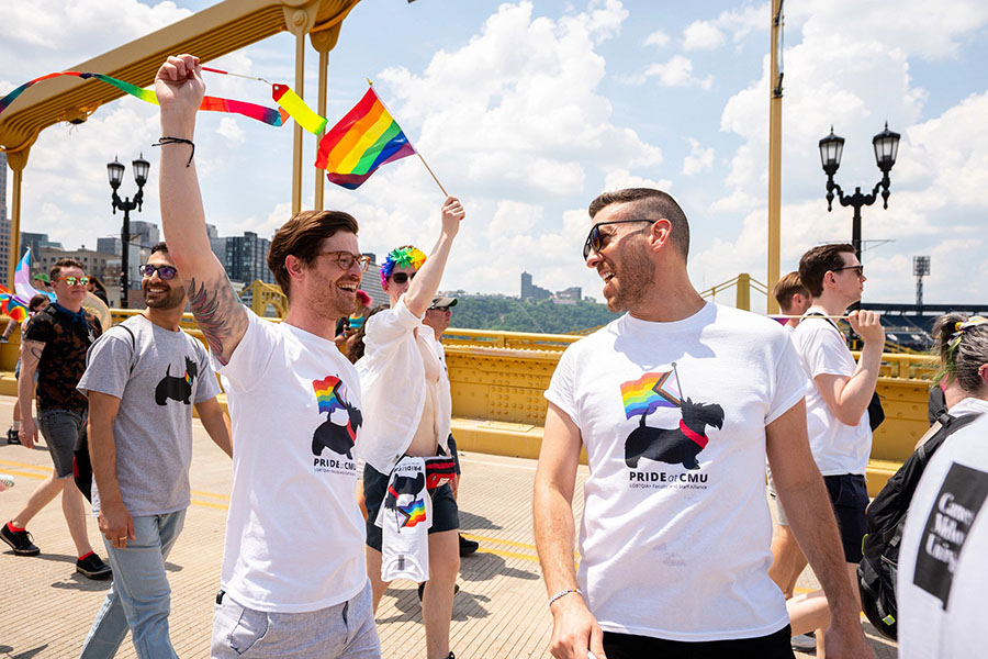 CMU participants marching across bridge during Pride March and Parade