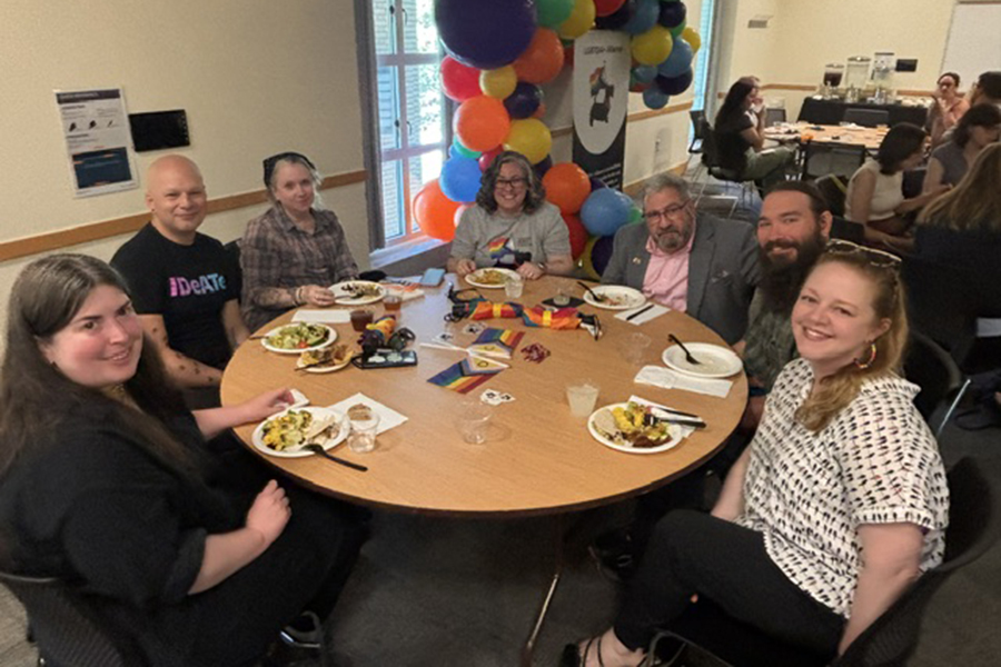 Group of attendees seated at table during Pride Lunch