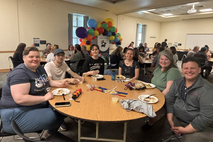 Group of attendees seated at table during Pride Lunch