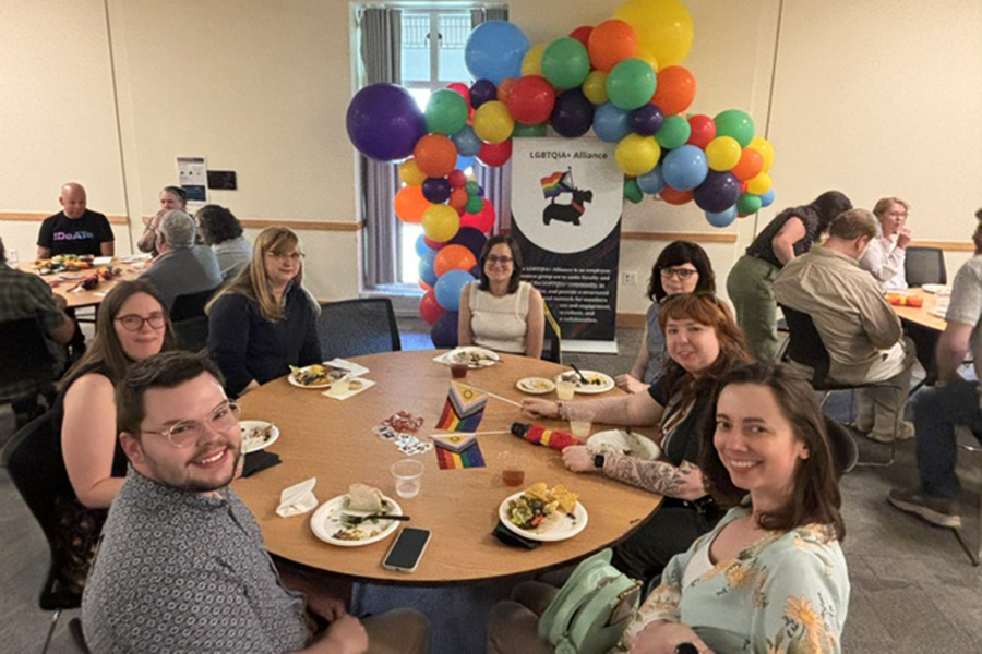 Group of attendees seated at table during Pride Lunch