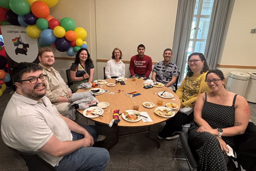 Group of attendees seated at table during Pride Lunch