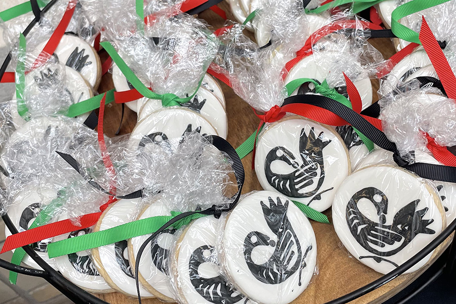 Cookies printed with Sankofa symbol of a bird with its head turned backward, feet facing forward and carrying an egg in its mouth