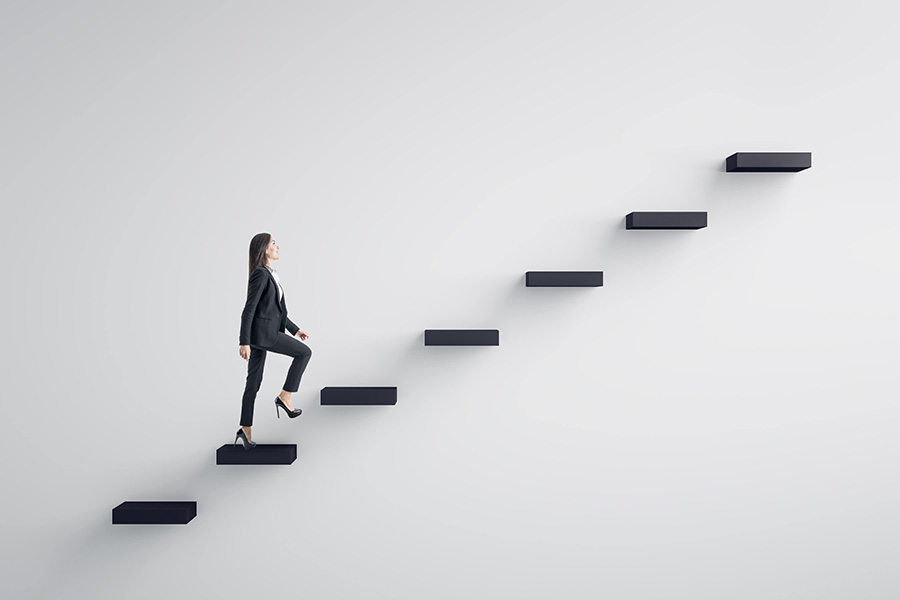 Business woman walking up conceptual ladder