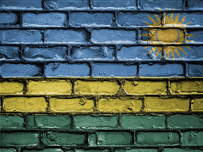 Rwanda flag painted on brick background