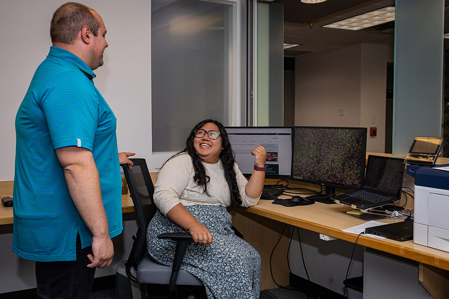 Two HR employees at desk in HR Service Center