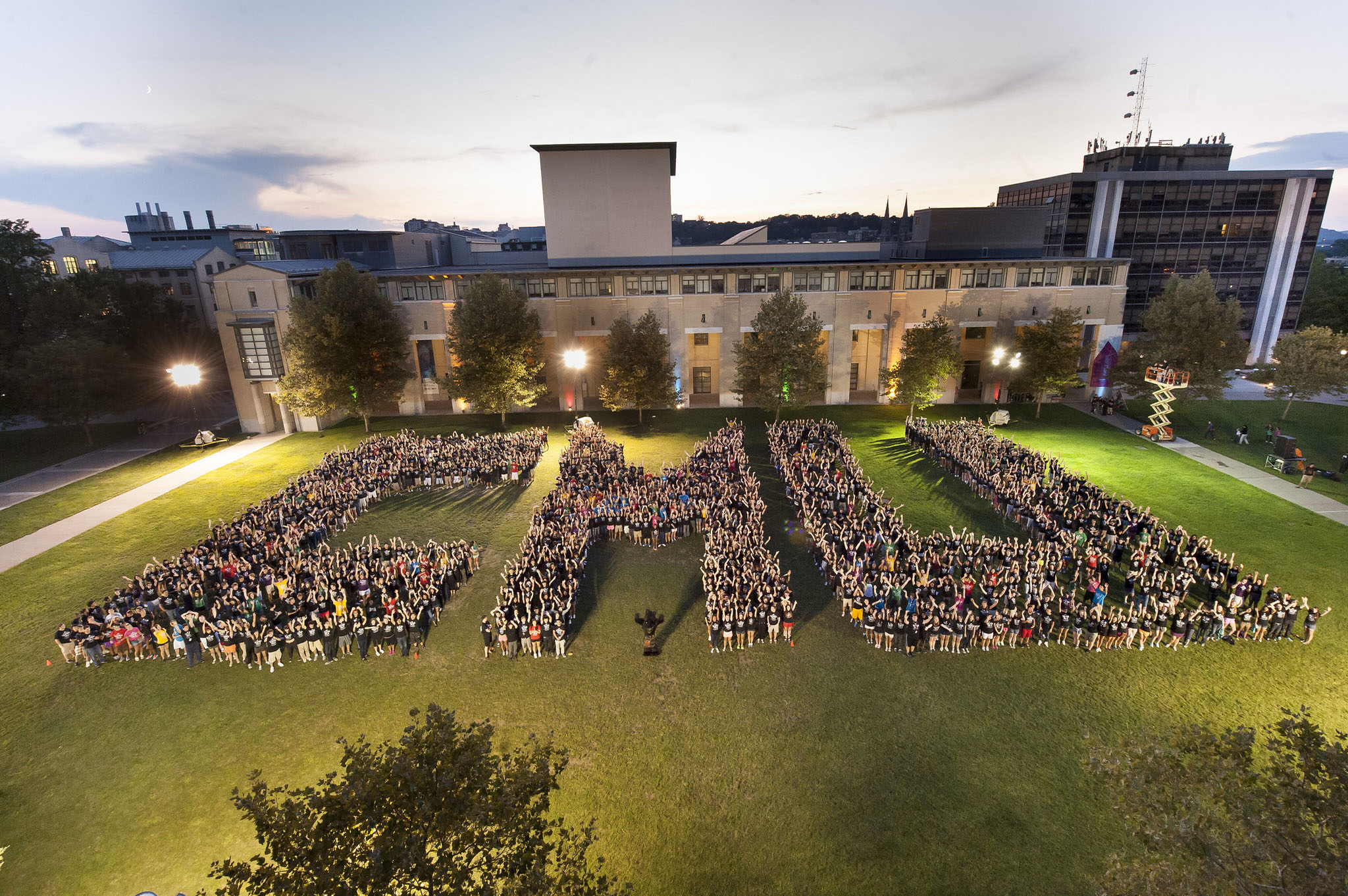 Group of students spelling out CMU