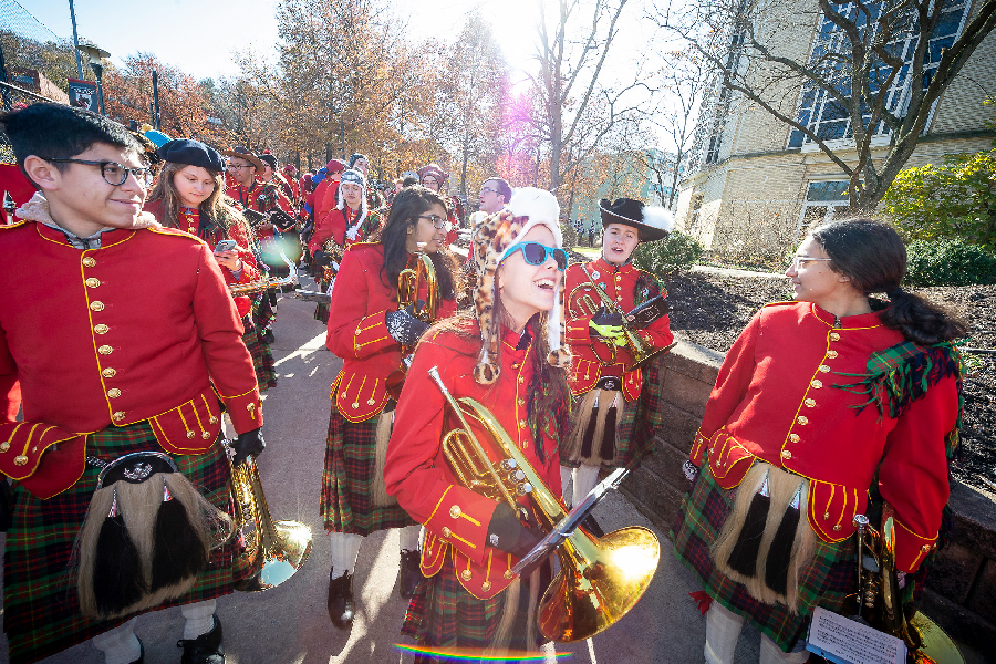 Ceilidh band on campus laughing and smiling