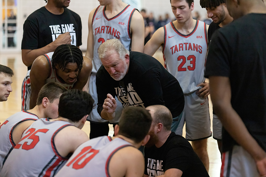 Coach Wingen talks to players during a game