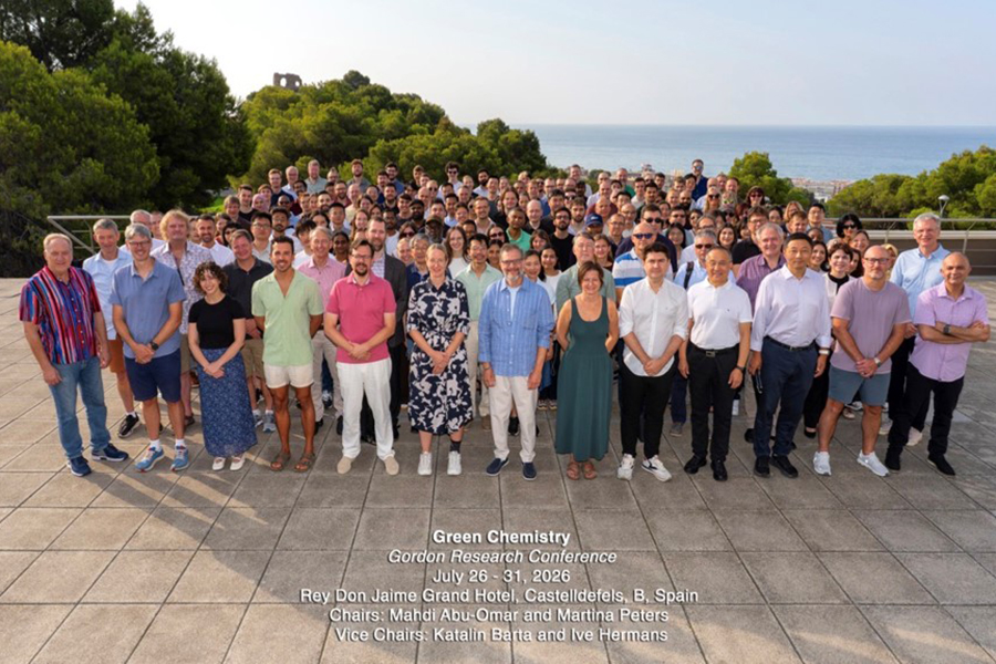 Group of participants at the Gordon Research Conference in Barcelona, Spain, posing together outdoors on a sunny day.