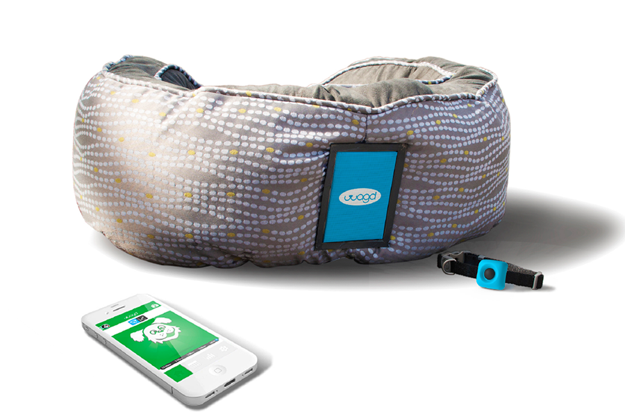 Image of a phone with the WAGD mobile app screen, the connected collar, and the dog bed