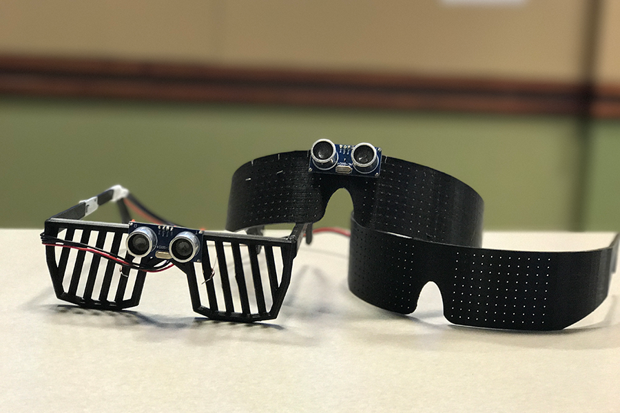 A photo of three Snapberry prototypes, which resemble various sunglasses with attached sensors and cameras