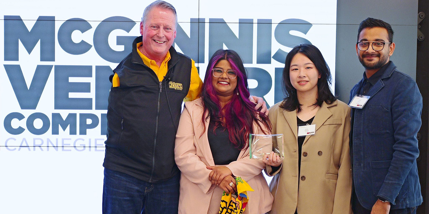 Competition winners standing with their award 