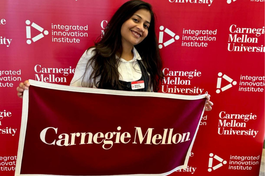 Sahaana holding a CMU flag