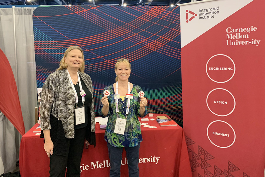 Admissions Director Chris Zeise and Program Director Gladys Mercier at CMU booth