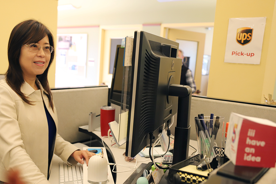 Catherine Fang at desk