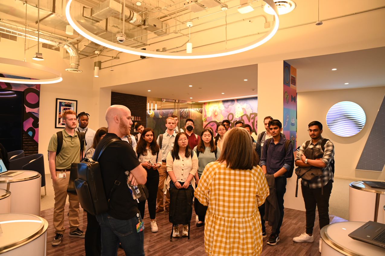 student abhishek iyer and fellow interns are standing in a group with HP leadership touring the headquarters