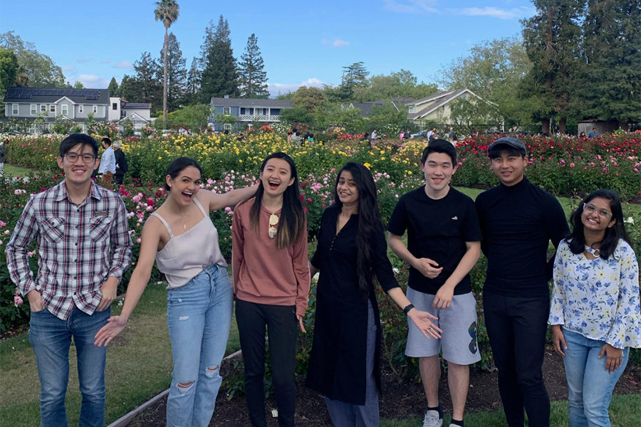 group of students posing in a garden