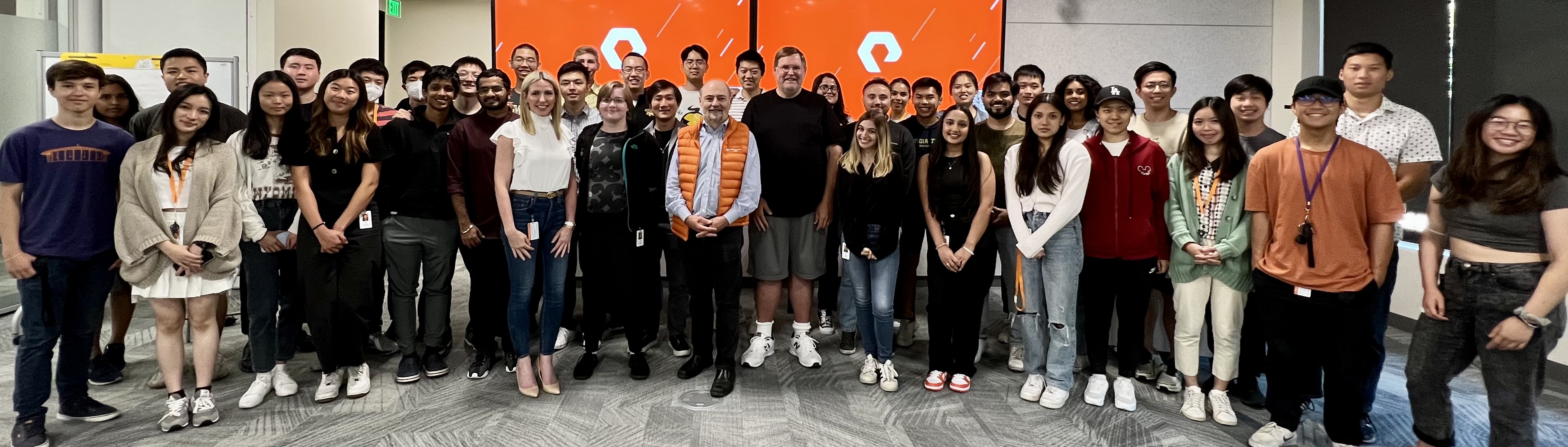 student mohammed azhar poses with fellow interns and CEO of Pure Storage, Charles Giancarlo 