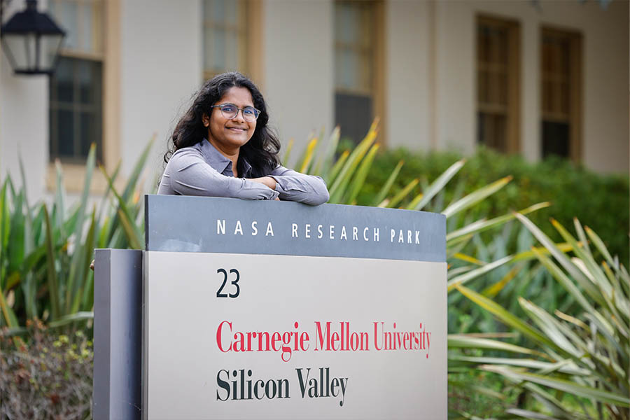 Pranathi leaning on Silicon Valley welcome sign