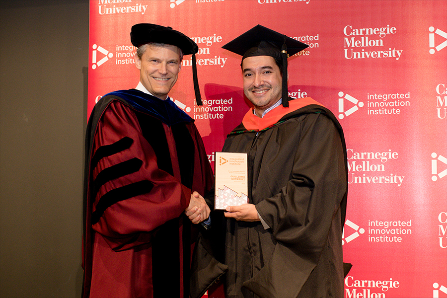 iii Program Director Peter Boatwright presents Guillermo Gutierrez with his award