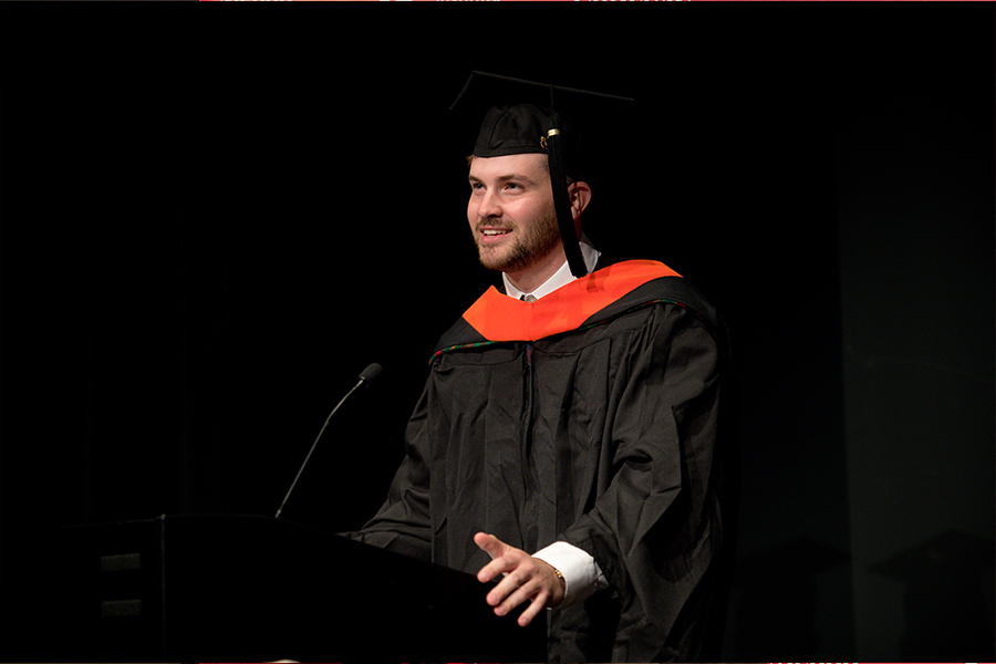 Kevin Killeen stands at the podium delivering his graduation speech
