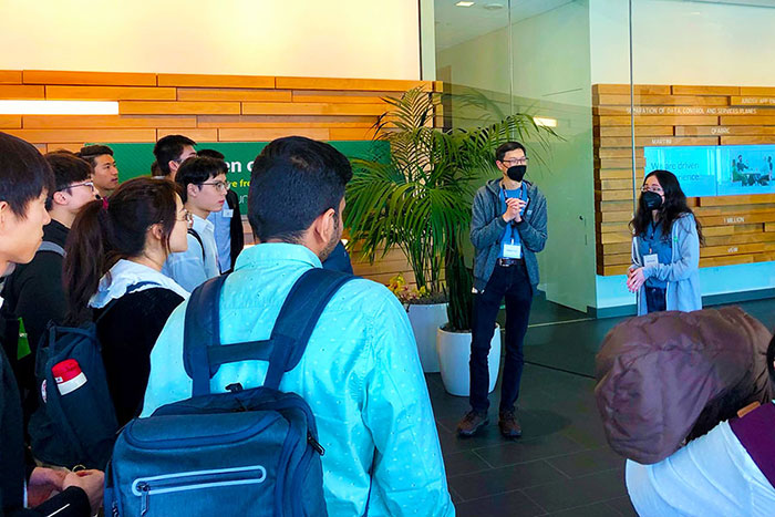 students listen to a speaker at Juniper Networks