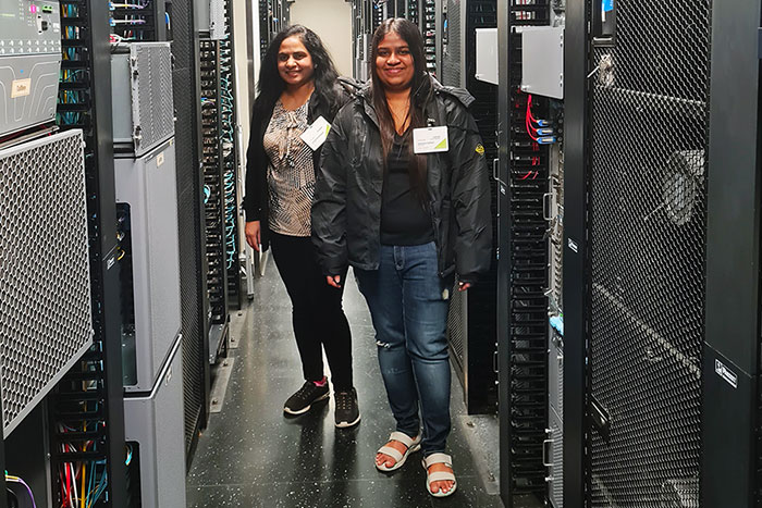 students gather in server room at juniper networks