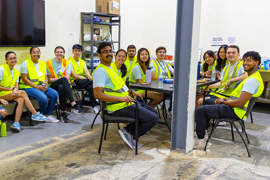 Mahir and fellow interns at a Canon warehouse event