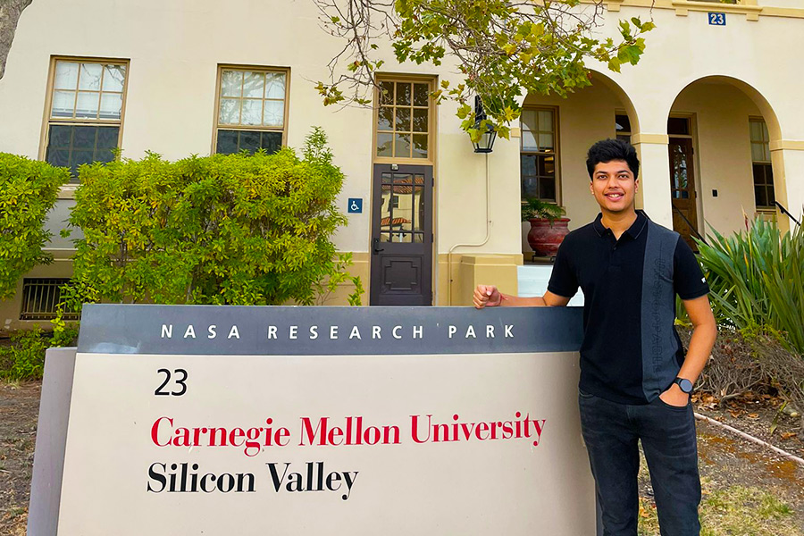 utkarsh stands in front of CMU Silicon Valley sign
