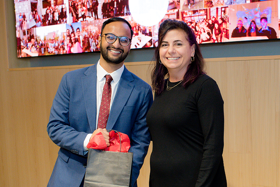 MIIPS program director Ellen Ayoob and graduating student Rishi Bhargava pose for a photo together with the iii student award