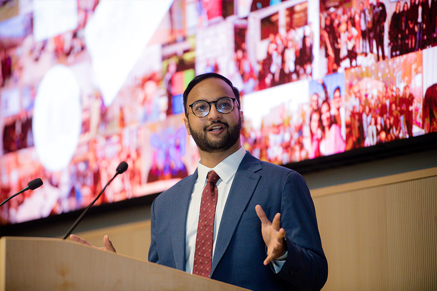 Rishi Bhargava addresses the audience from behind a podium