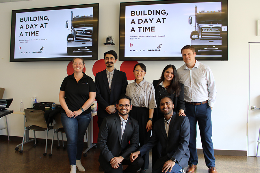 IPD capstone team poses with sponsors from Mack for a photograph