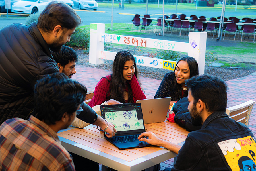 Professor Prayaga talks to her students about Interaction Design, specifically Apple products