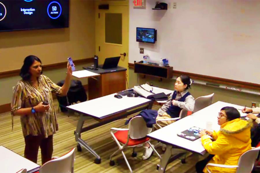 professor teaches about the principles of interaction design