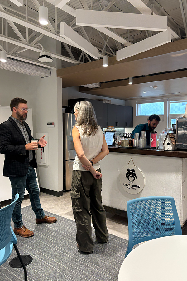 People gather around a coffee cart
