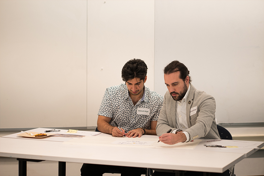 Two people collaborate on a project together