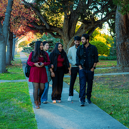 students walking across the silicon valley campus after class