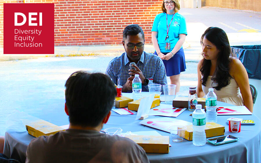 students gathered around a table