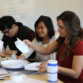 a group of students working on a project at a table